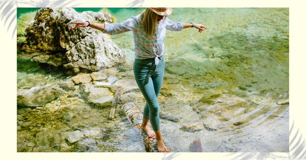 Soft-focus image of woman in wellness wear, standing peacefully in nature – vaginal health concept