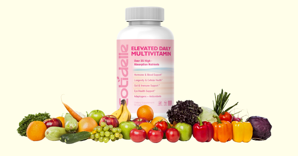Cotidelle multivitamin bottle  surrounded with fruits and veggies with adaptogens and antioxidants